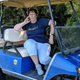Golf cart Gail doing what she does best.